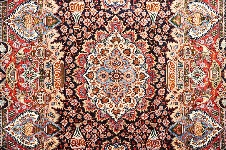 A Kashmar carpet, a. 300 x 200 cm.