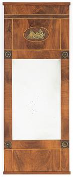 A mahogany veneered Empire mirror, first half of the 19th Century.