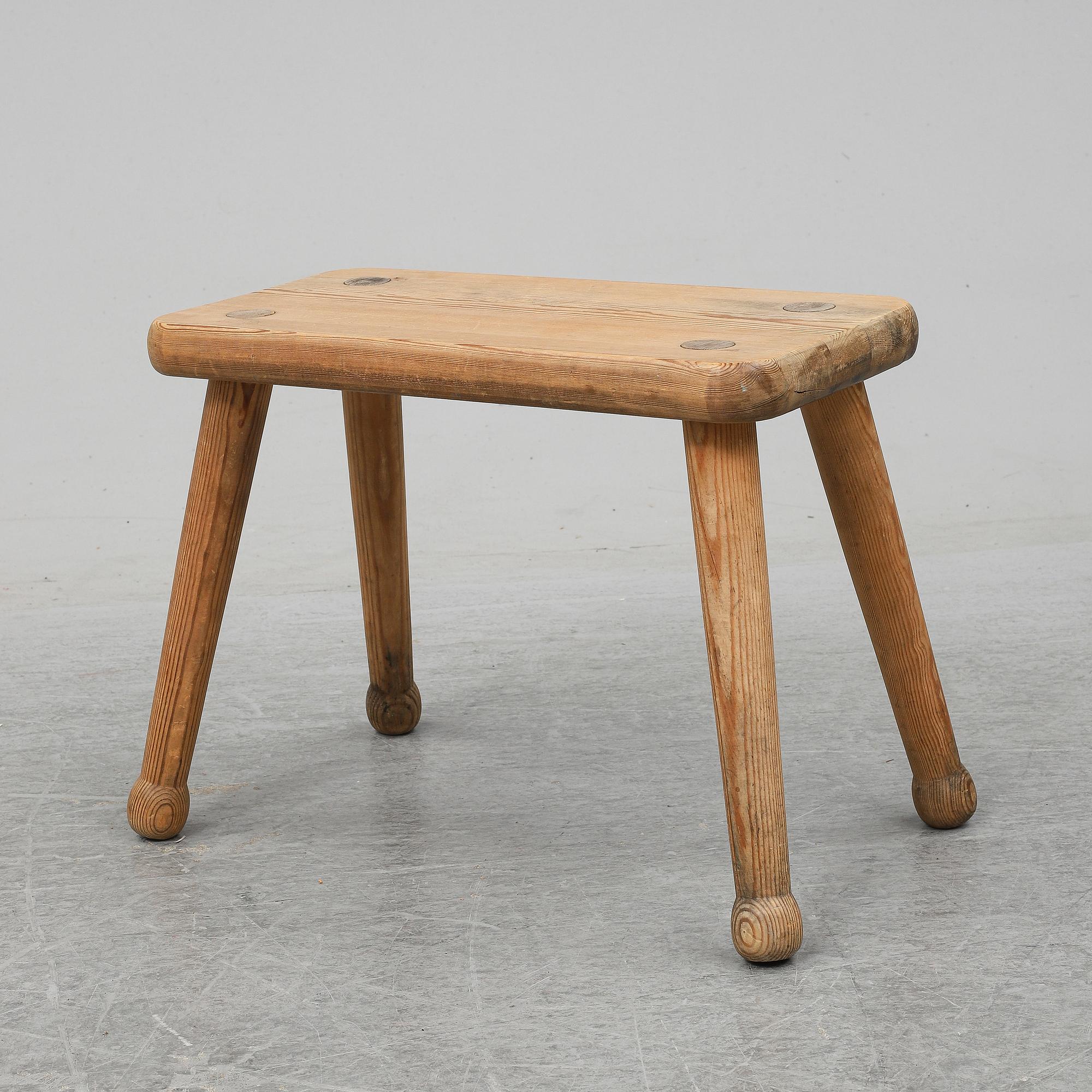 A pine stool, second half of the 20th century.