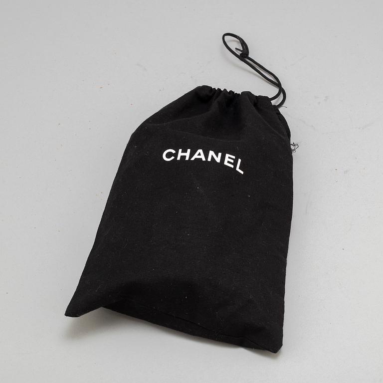 CHANEL, a black leather 'Extra mini flap bag' 2012-13.