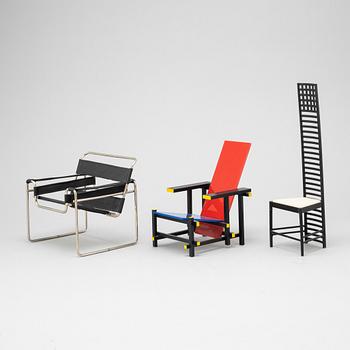 Miniatures of three famous design chairs, 21st century.