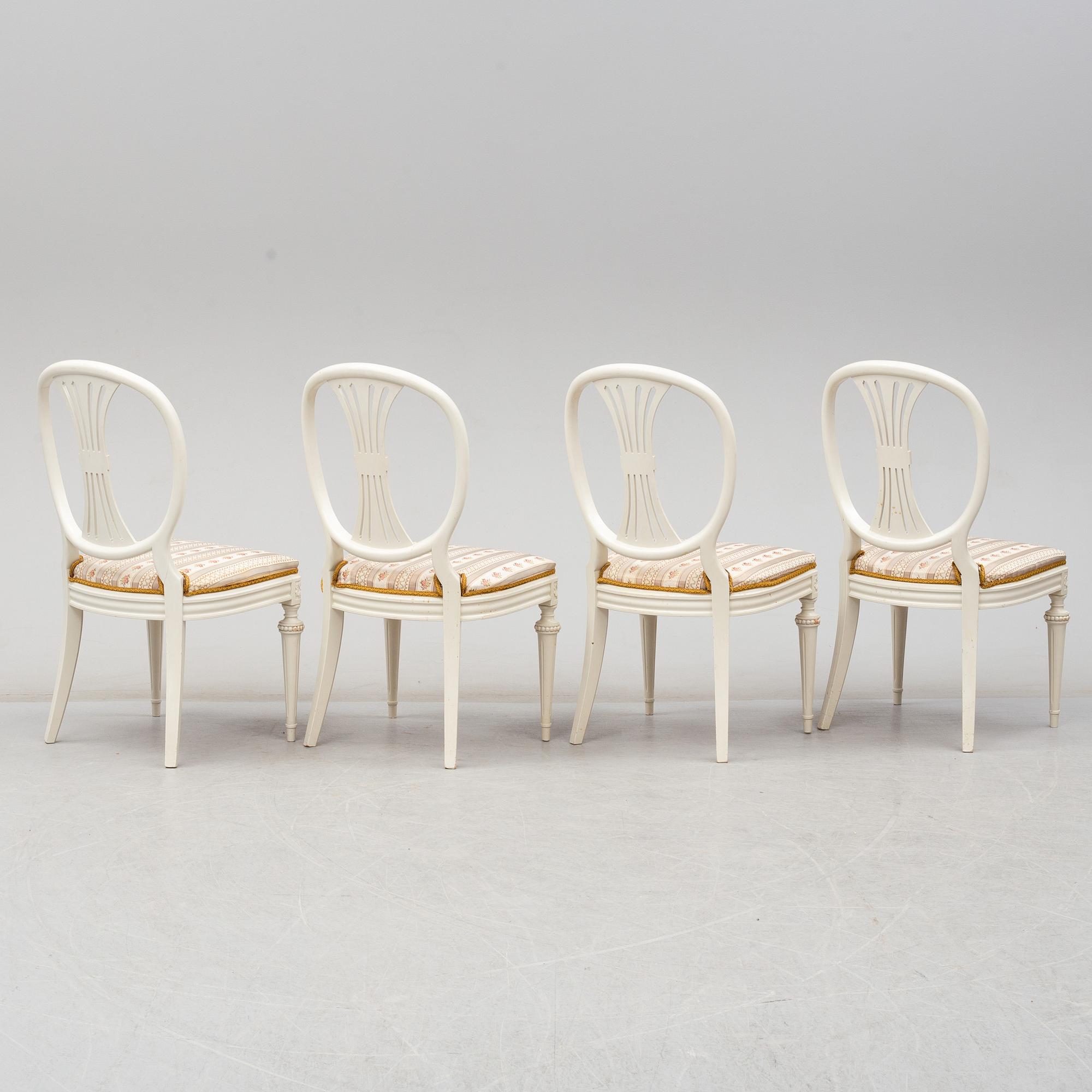 Four chairs with dinner table, late 20th Century.