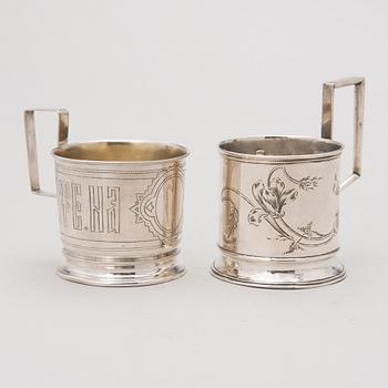 Two tea glass holders in silver, one with mark of Ivan Saltykov, Moscow 1889, the other one marked Moscow 1908-1917.