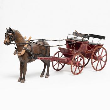 Horse-drawn carriage, early 20th century.