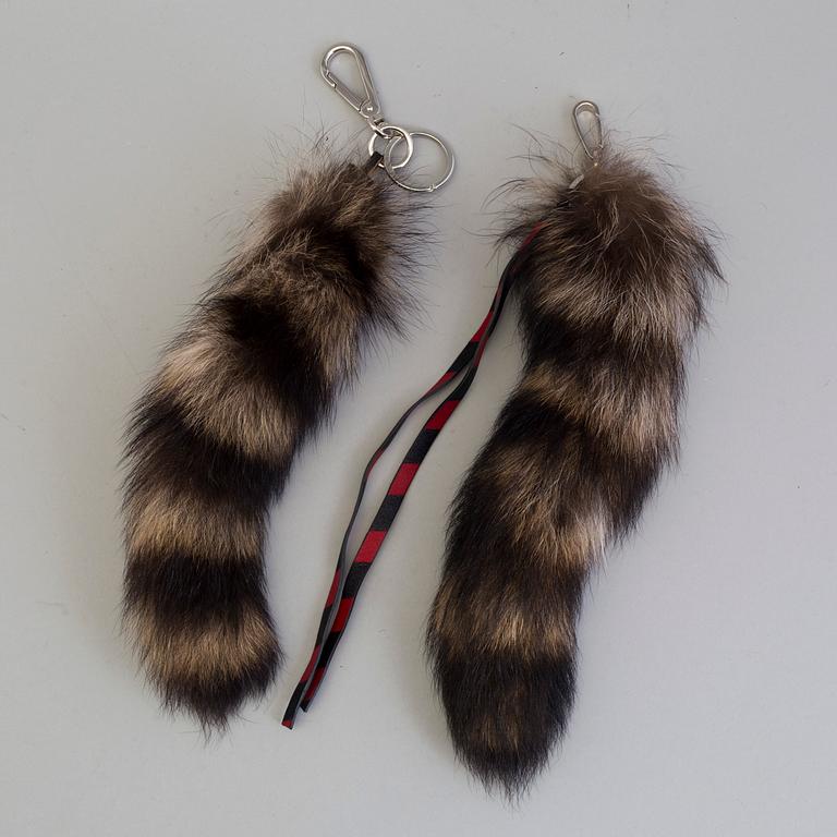 Two Bag accessories, by Marni and Miu Miu.