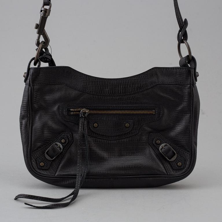 A black alligator printed leather "Classic hip" bag by Balenciaga.