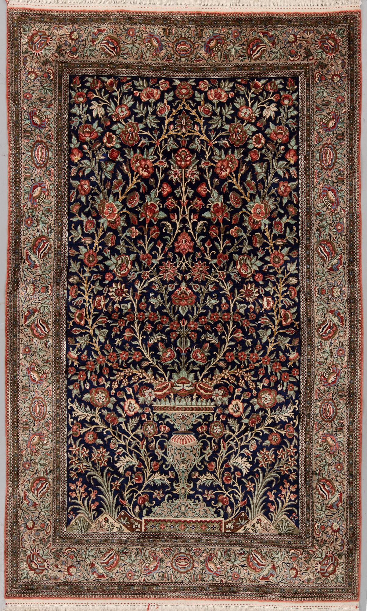 A SILK QUM RUG, ca 222 x 139 cm.