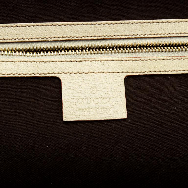 A Gucci canvas and leather hand bag.