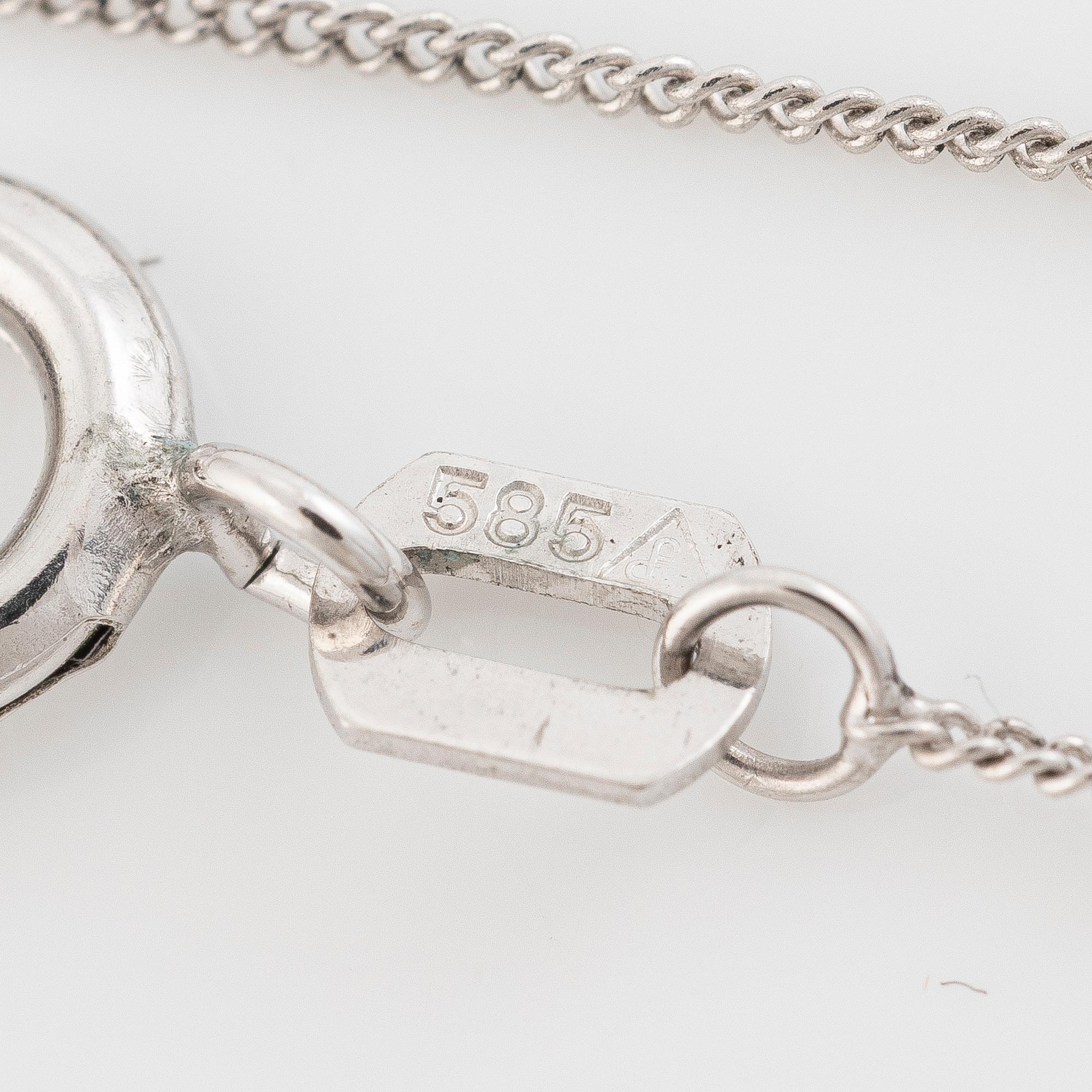 14K white gold necklace with a faceted sapphire.