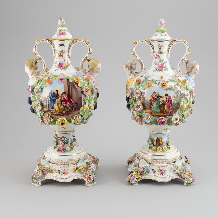 A pair of enamelled earthenware vases with covers, 20th century.