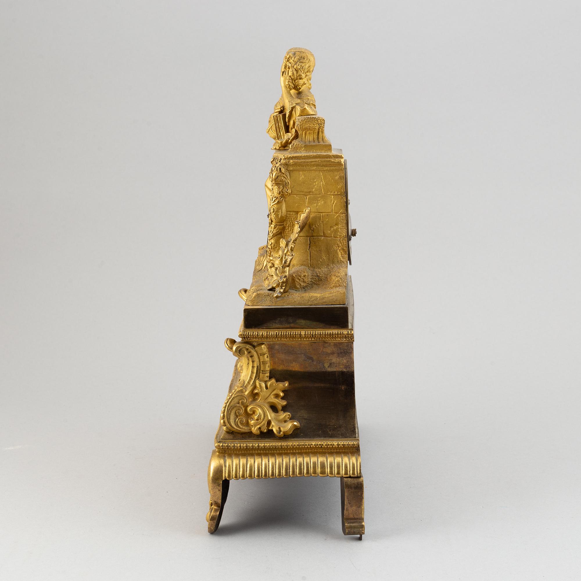 A rococo style brass mantle clock, second half of the 19th Century.