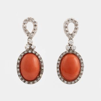 Coral and brilliant cut diamond earrings.