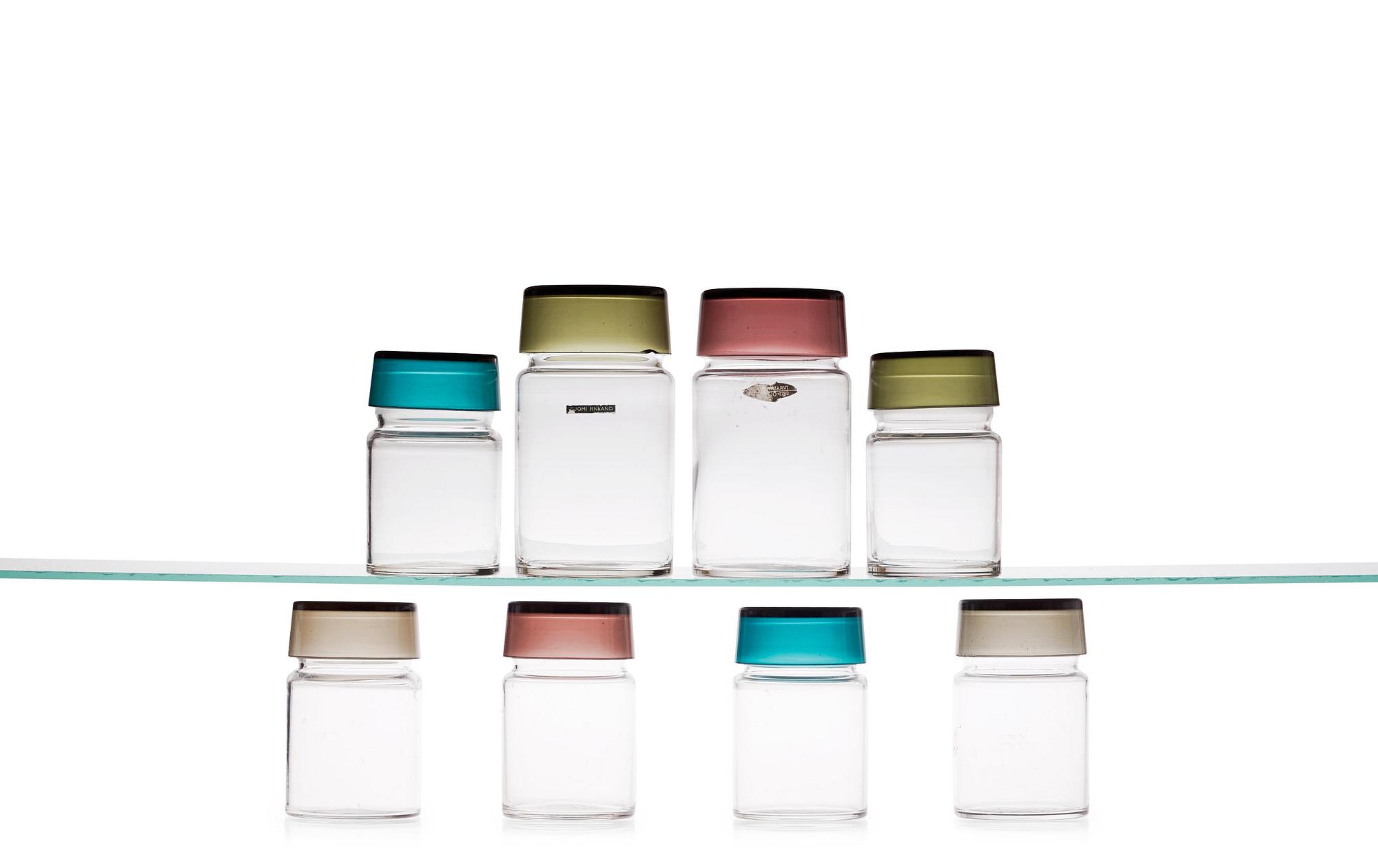 A set of eight Saara Hopea glass spice jars with covers, Nuutajärvi, Notsjö, Finland 1950's.
