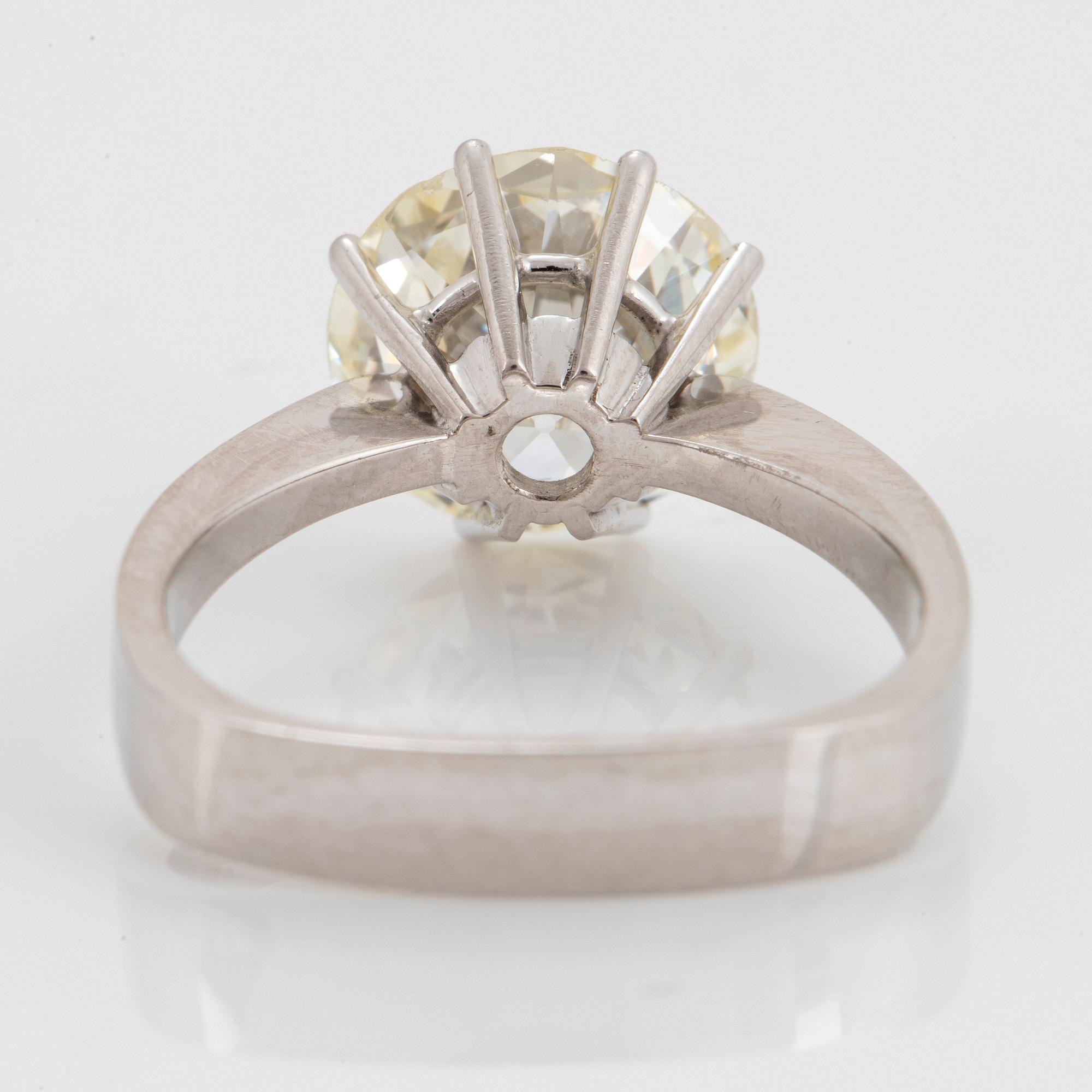 A platinum ring set with an old-cut diamond weight ca 4.00 cts quality ca N/O si.