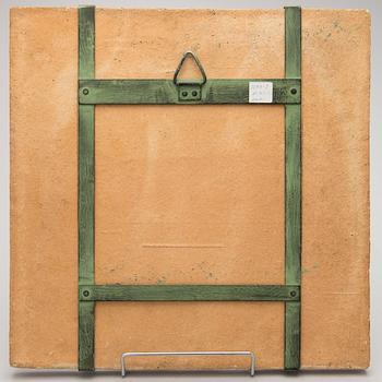 A stoneware plaquet signed Kaipiainen.