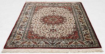 A Ghom silk rug, signed, c. 148 x 100 cm.