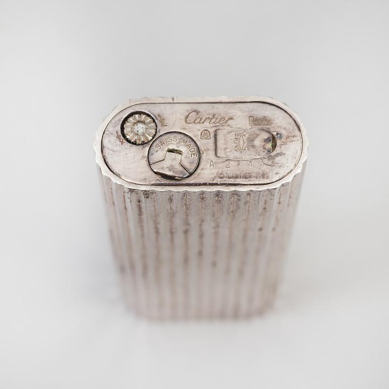 a 20th century Cartier lighter with original box from Paris.