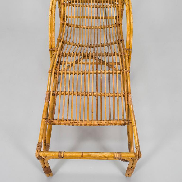 A mid-20th century rattan lounge chair.
