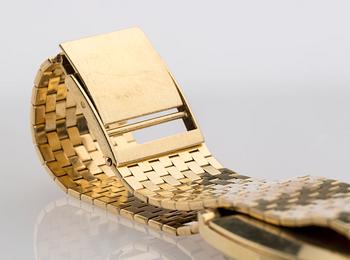 ARMBANDSUR, herr, Tissot, 18K guld. 1970-talets senare del. Vikt totalt ca 71 gram.