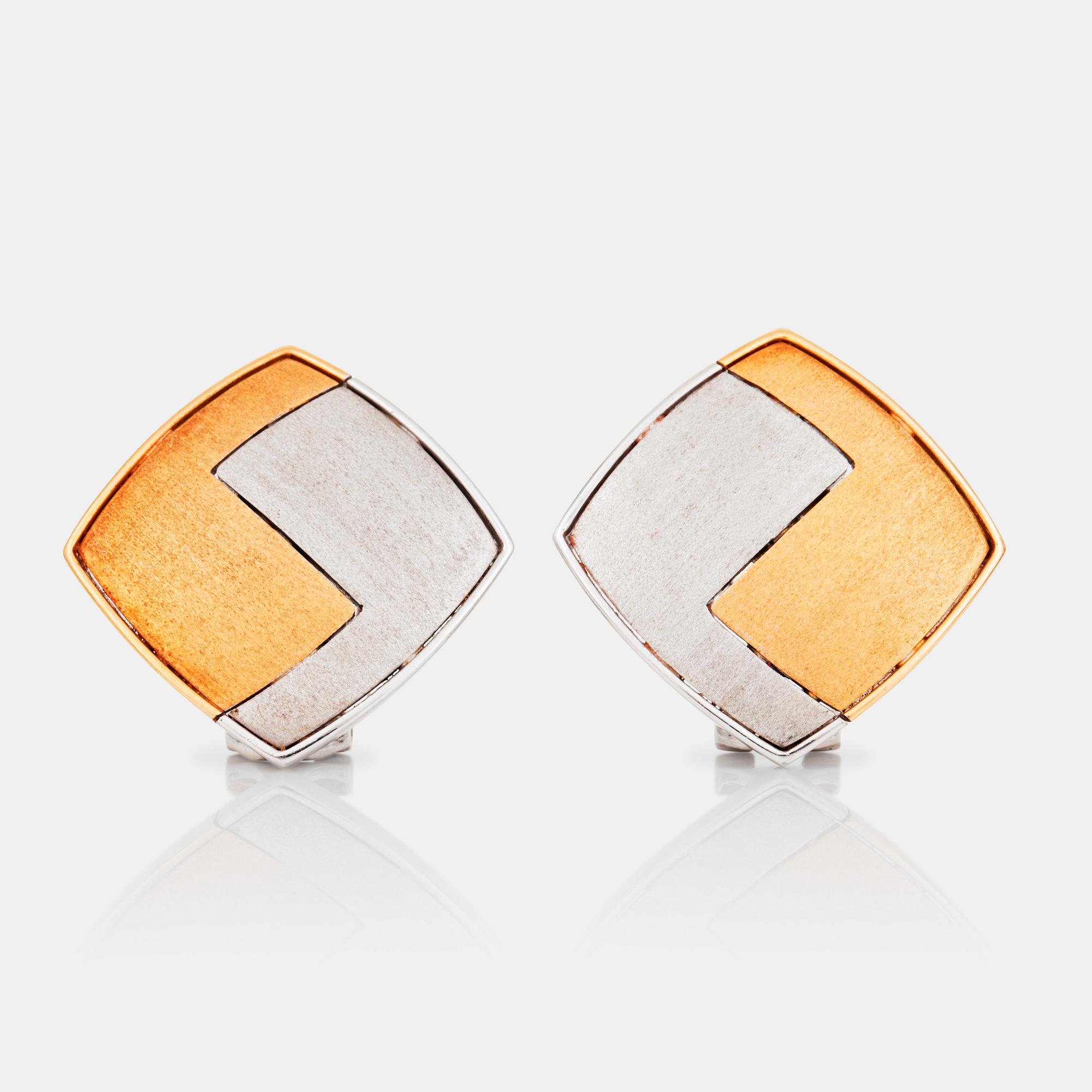 A pair of Paul Binder earrings.