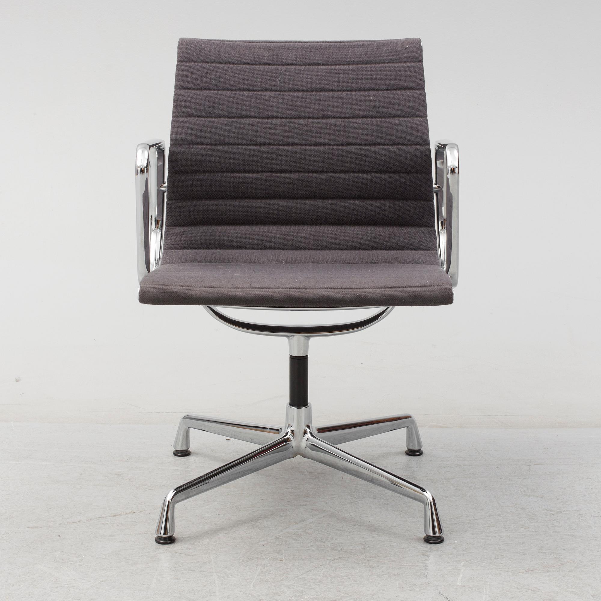 An 'EA 104 Swivel' armchair by Charles & Ray Eames, Vitra, 2007.