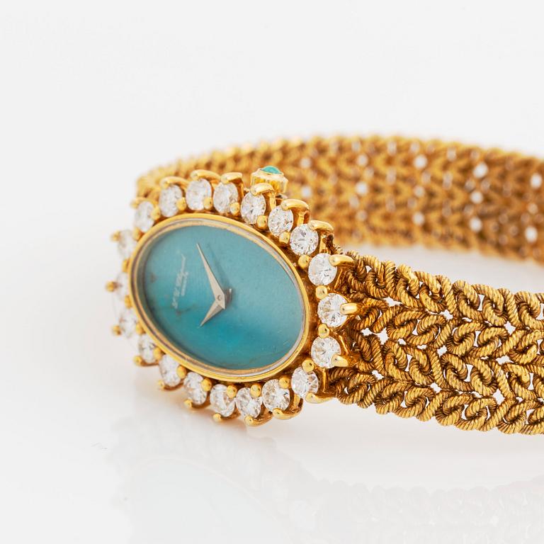 A Chopard for Kutchinsky 18K gold watch with a turquoise dial and a diamond bezel.
