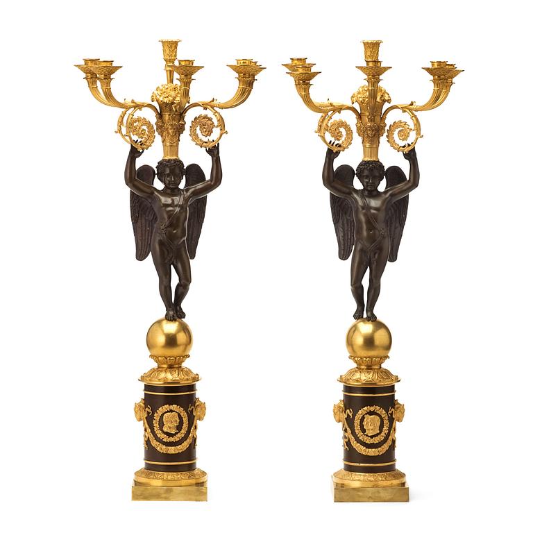 A large pair of French Chibout circa 1820 gilt and patinated bronze six-light candelabra.