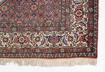 An oriental rug, approx. 238 x 174 cm.