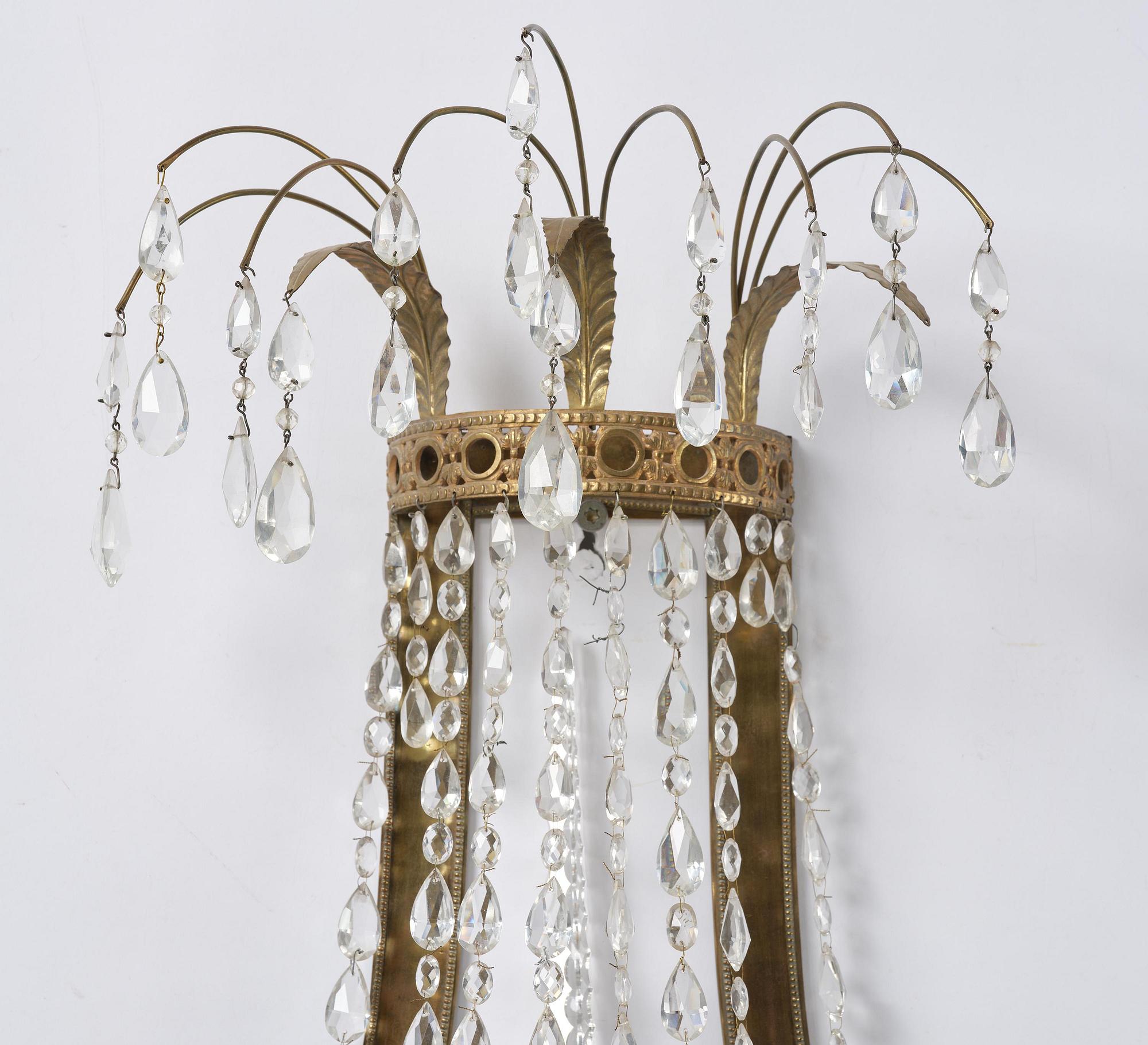 A pair of Russian Louis XVI-style  four-branch gilt bronze appliques, 19th century.