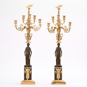 A pair of Empire early 19th century six-light candelabra.