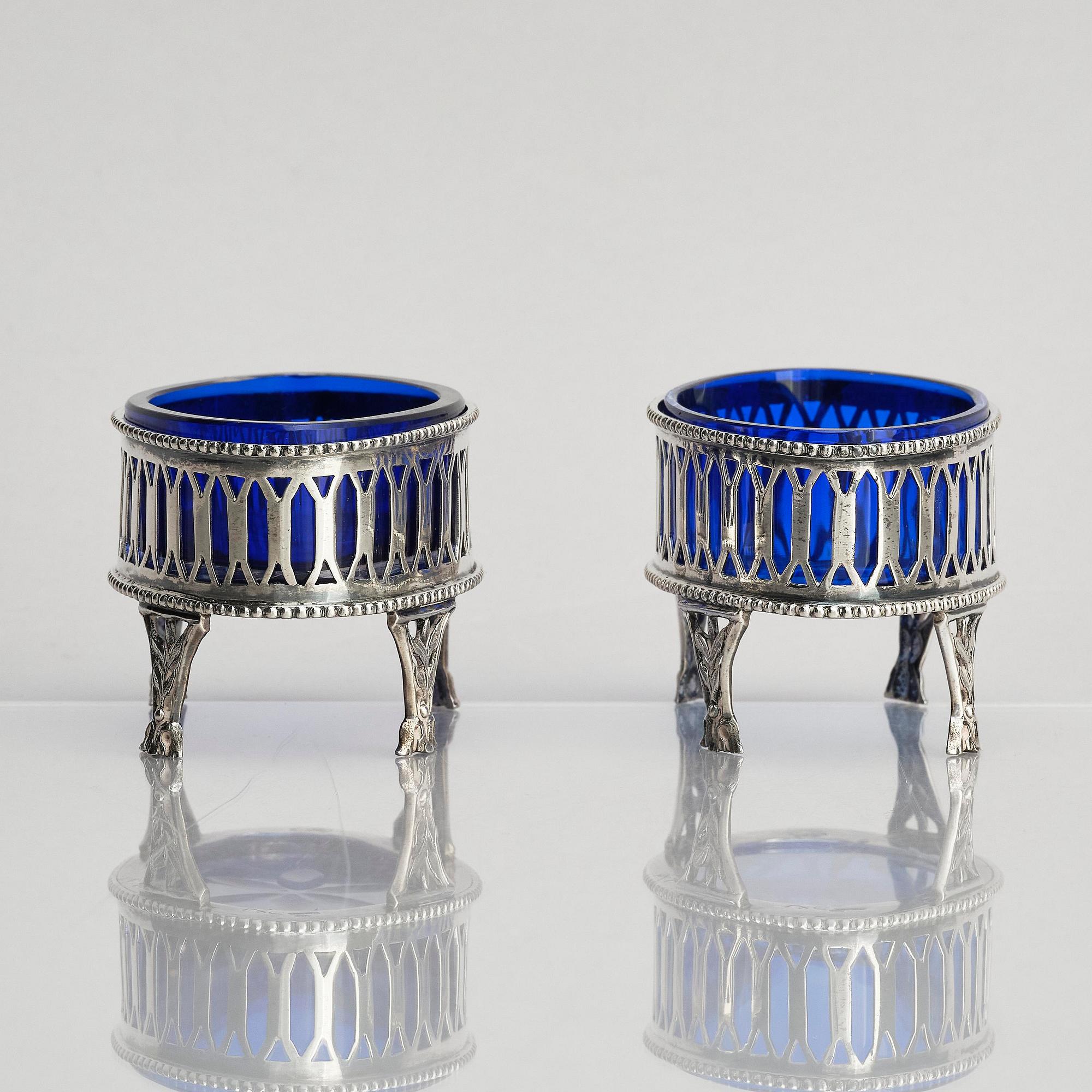 A pair of Swedish Gustavian 18th century silver and blue glass salt-cellars, marks of Olof Sedin, Gävle 1793.