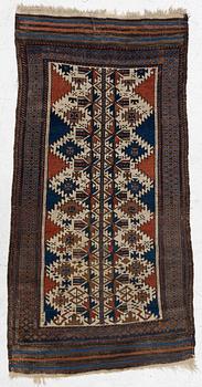 An antique Baluch rug, East Persia, c. 147 x 45 cm.