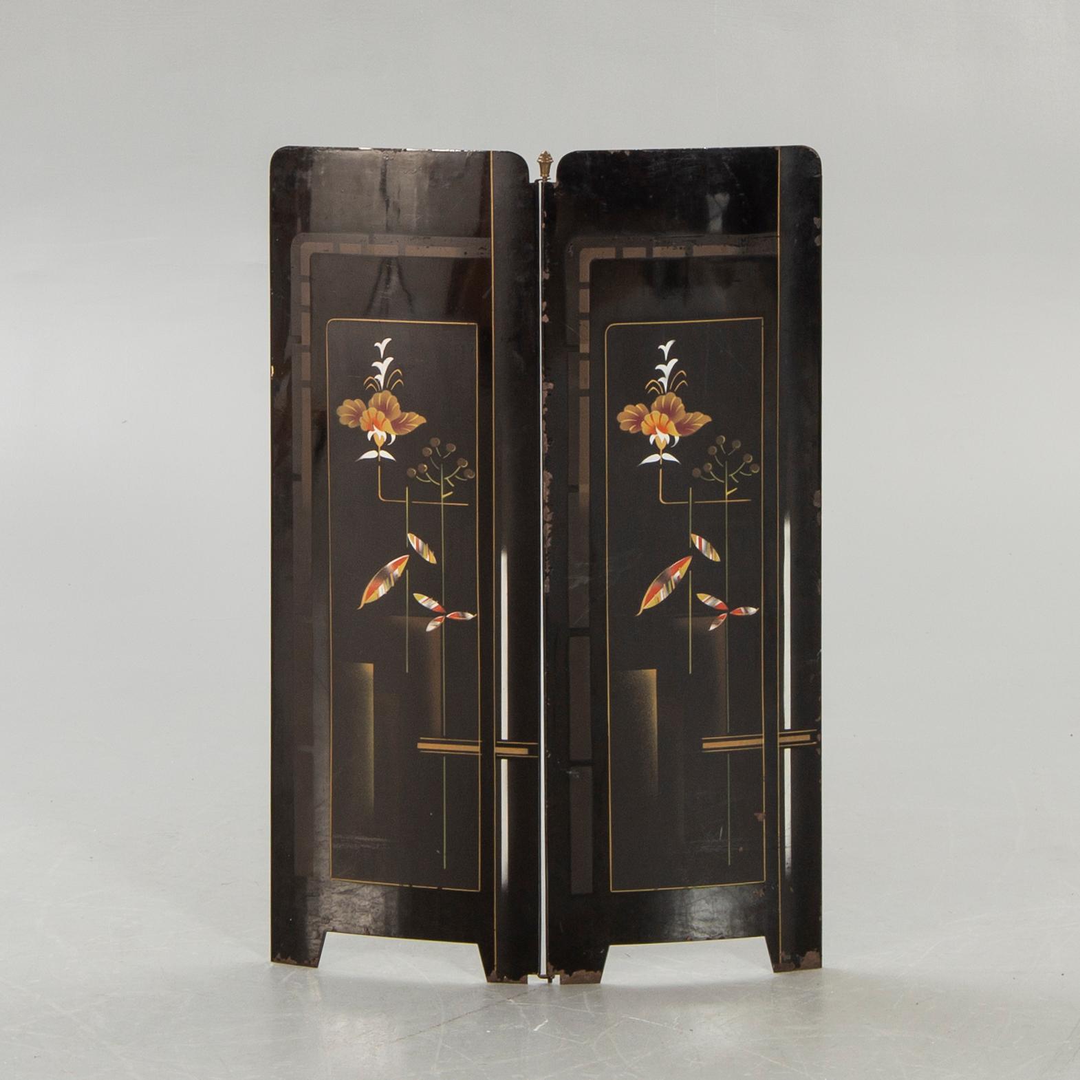 An early 1900s fire screen.