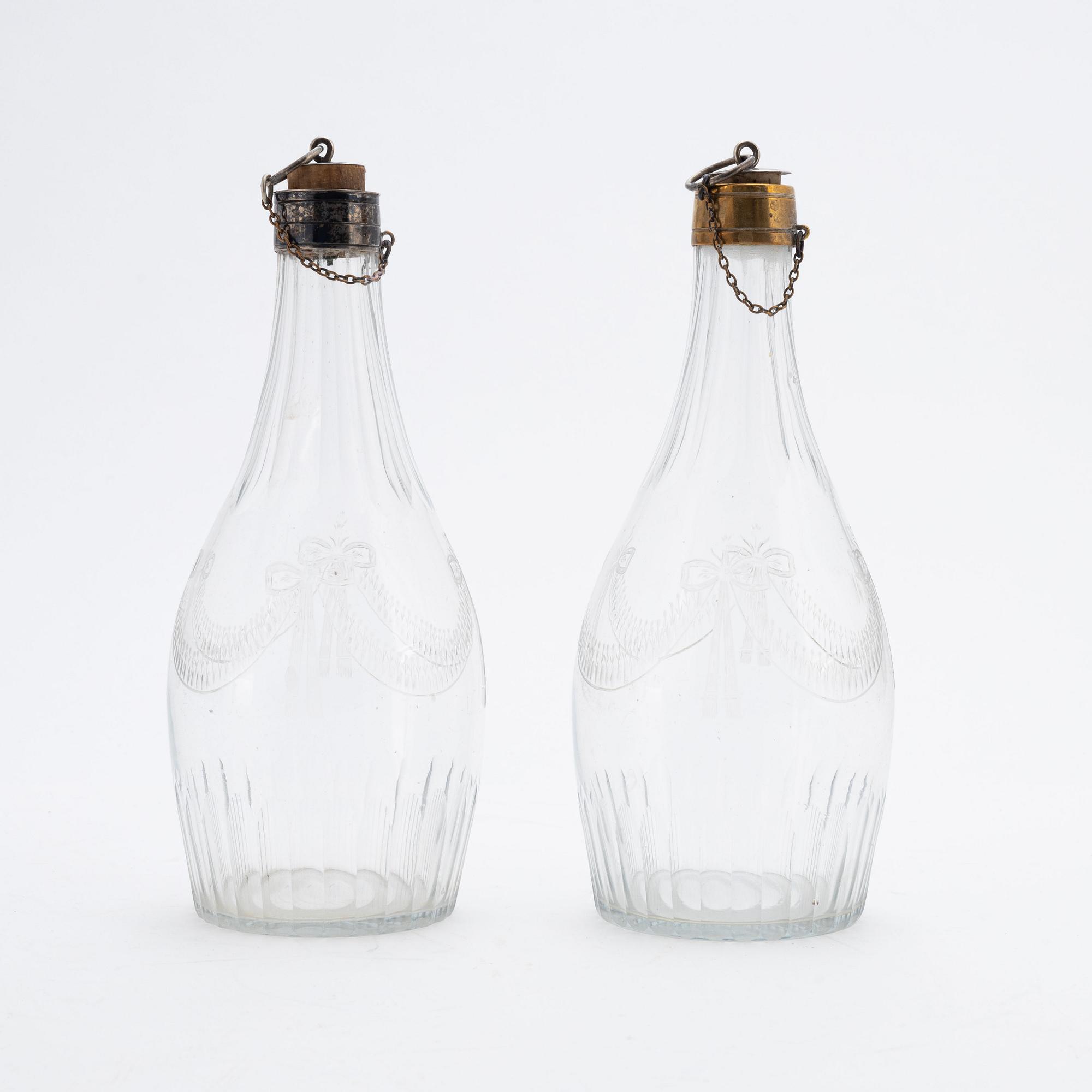 A pair of late gustavian glass and silver vinegar bottles, circa 1800.