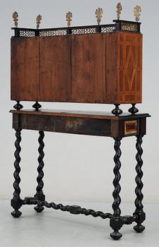 A Baroque 17/18th century cabinet, on later stand.