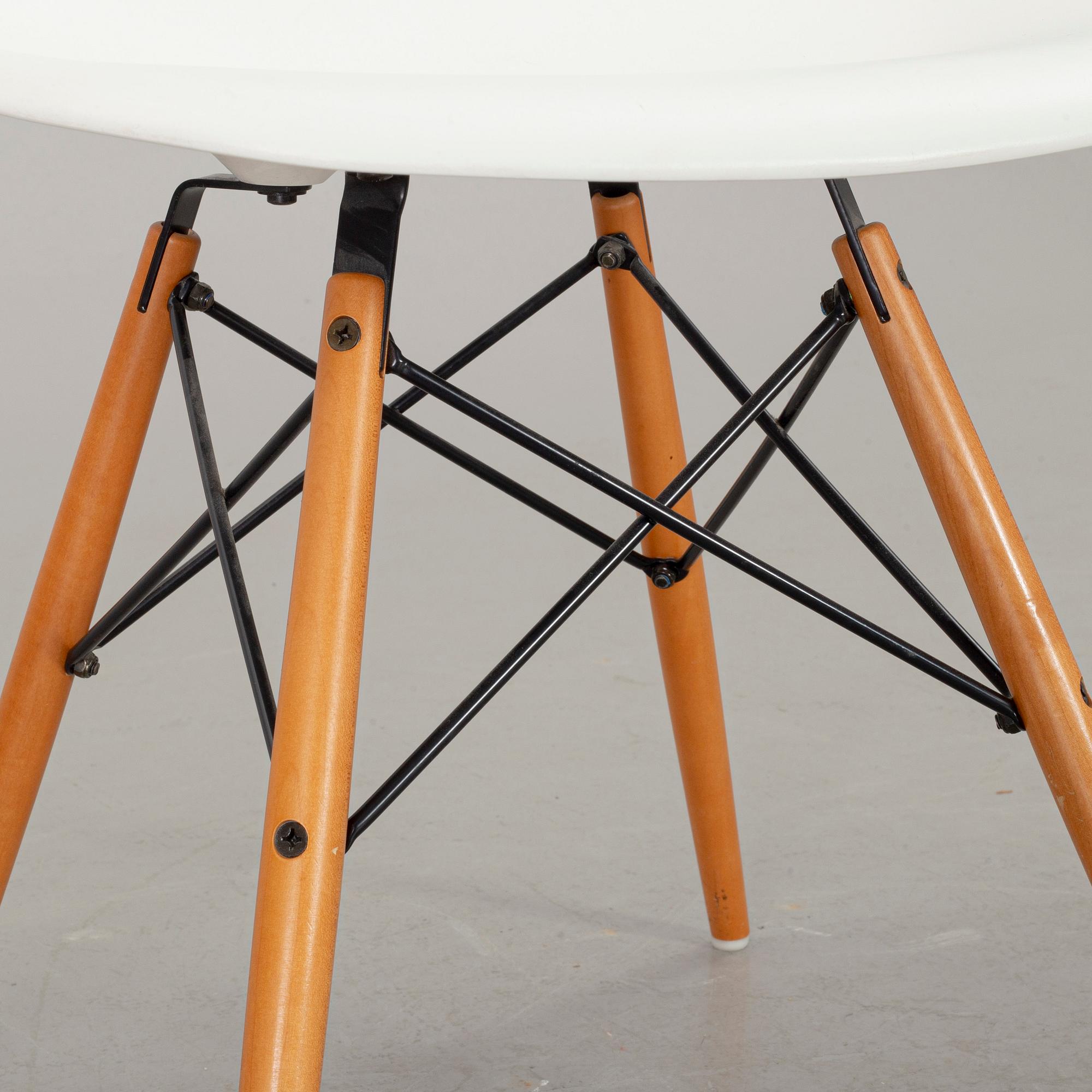 A PAIR OF "PLASTIC CHAIR" BY CHARLES & RAY EAMES, Vitra 2009.