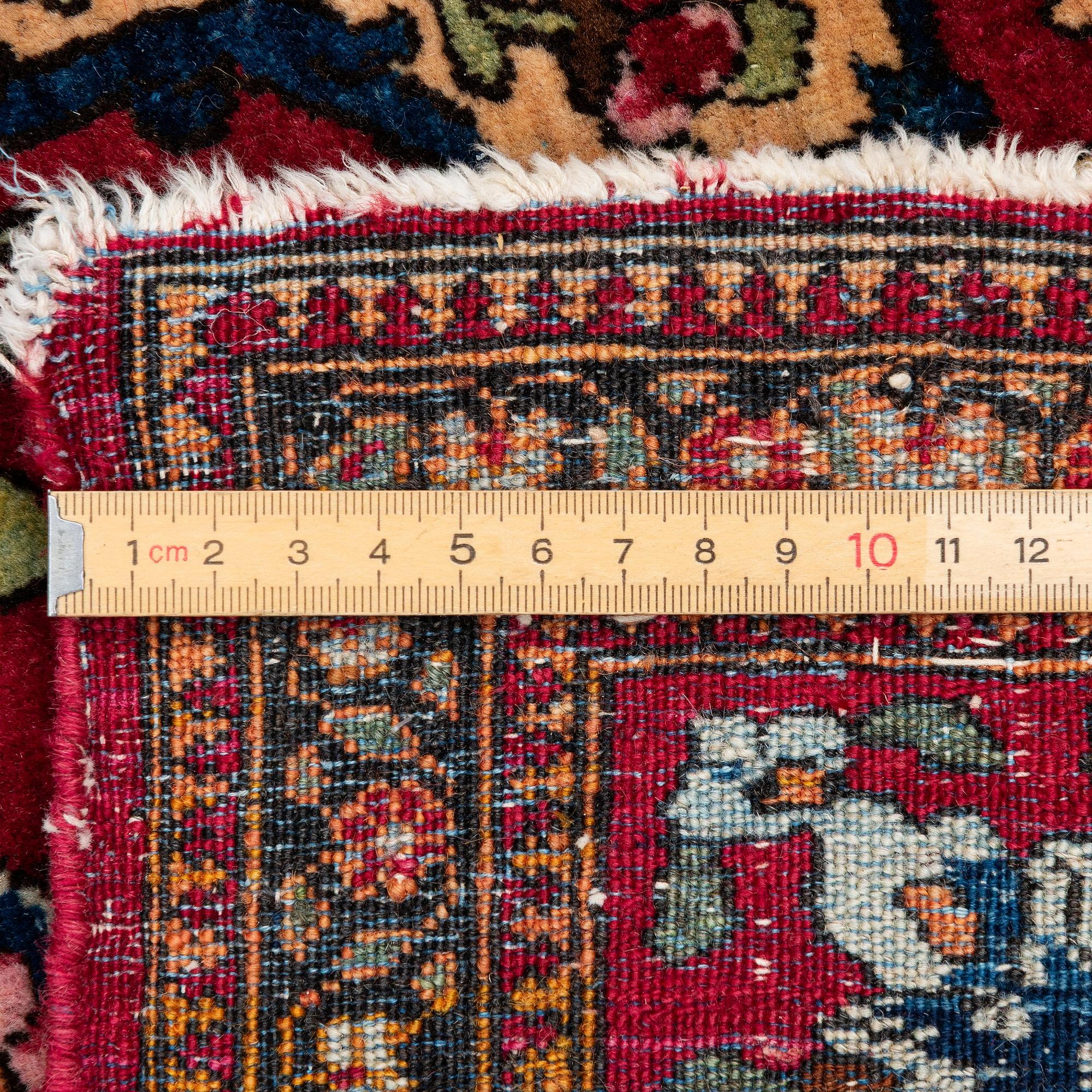 An antique Isfahan rug, Central Persia, c 234 x 146 cm.