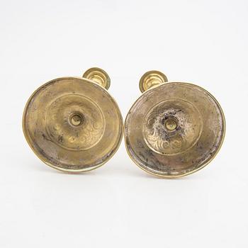 A pair of 19th century brass candle sticks.