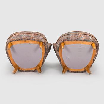 A pair of mid-20th century armchairs.