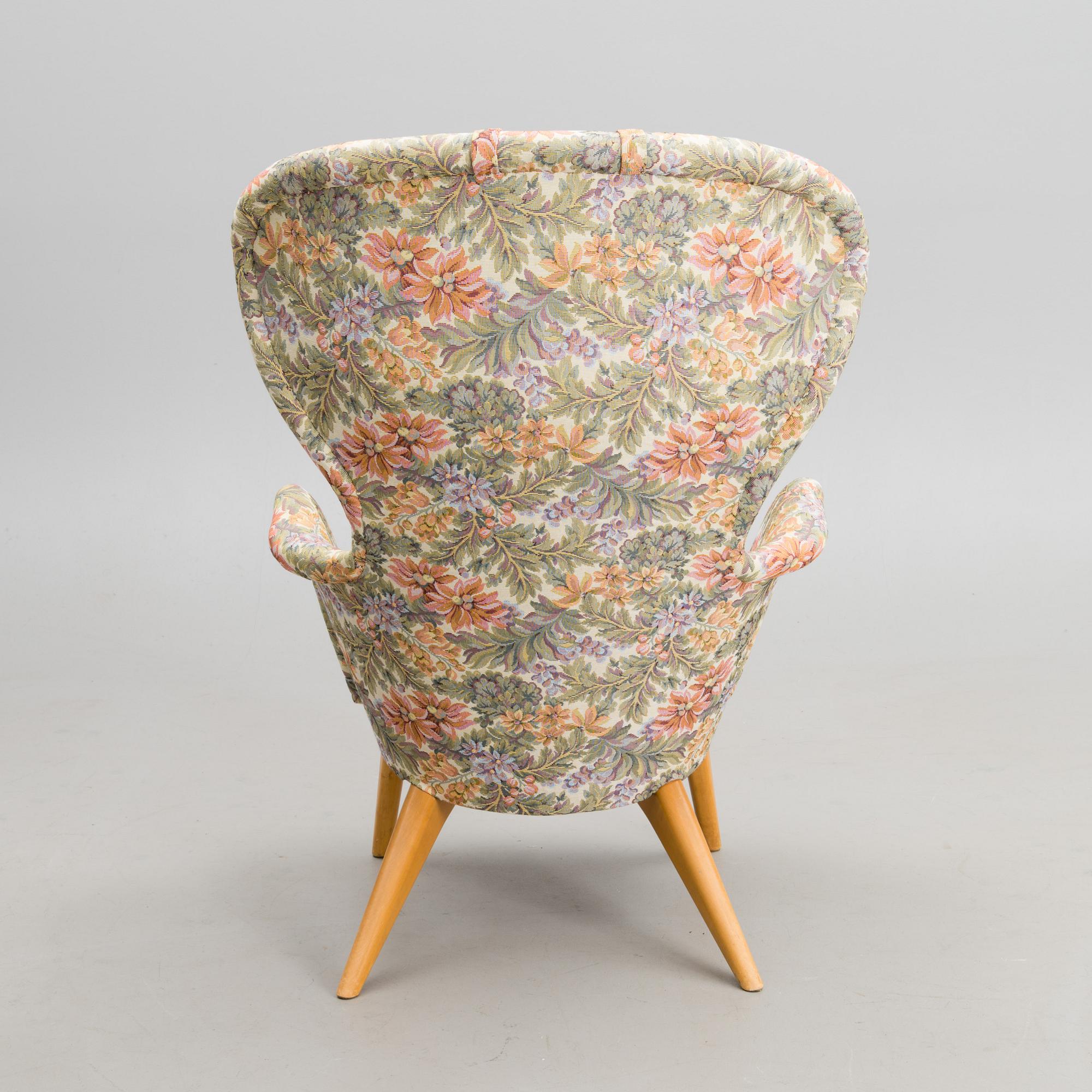 A mid-20th century armchair 'Siesta' manufacturer  Puunveisto Oy - Träsnideri Ab, Finland.
