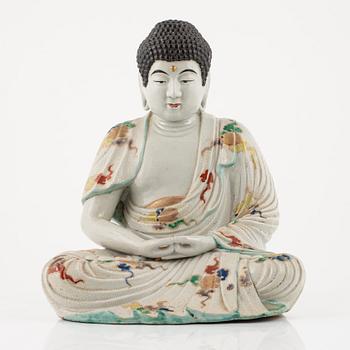 A porcelain buddha, Japan, 20th century.