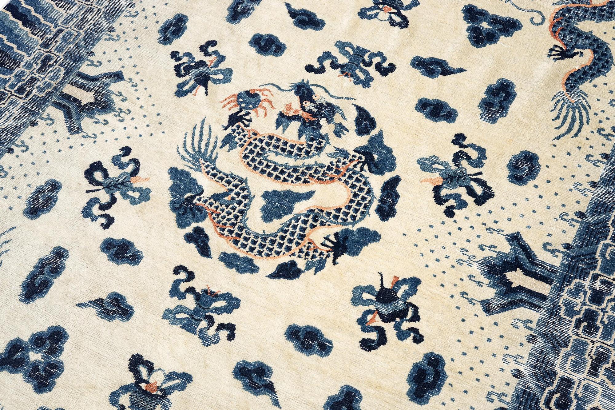 An antique Chinese ' five dragon rug', c. 280 x 190 cm.