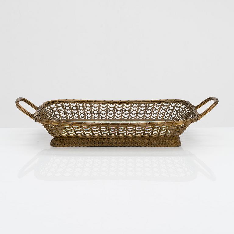 A 19th-century porcelain and brass basket, marked with 'Sèvres' mark.
