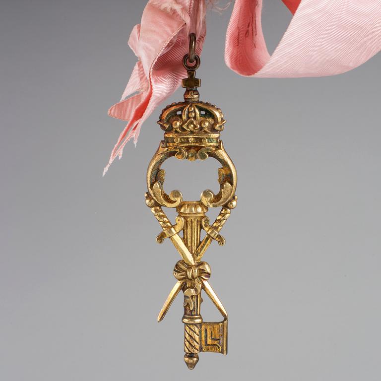 A sash with key 19/20th century.