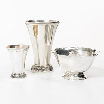 Two silver beakers and a bowl,