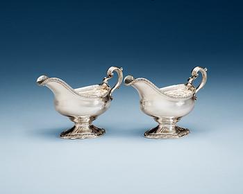 897. A pair of English 18th century silver sauce boats, makers mark of William Skeen, London 1766-1767.