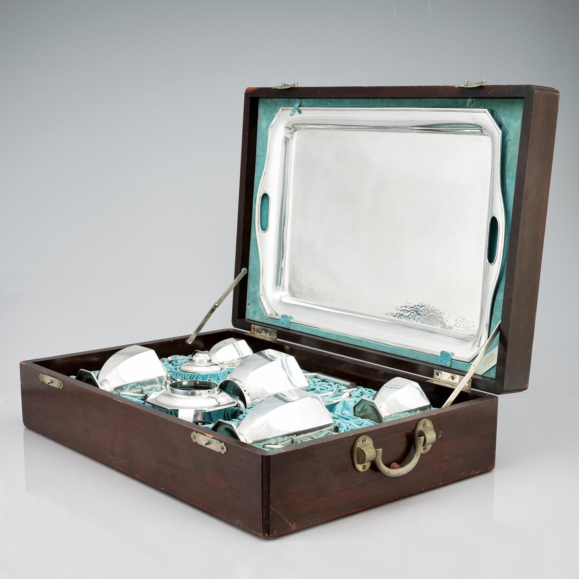 A box with a Japanese silver tea and coffee service by
