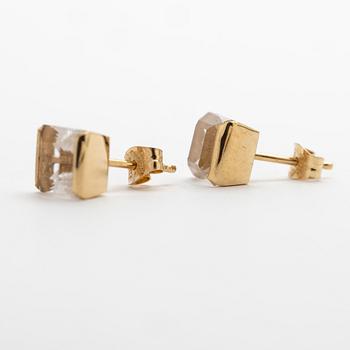 A pair of 18K gold earrings with rock crystal stones.