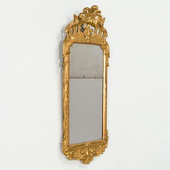 A Rococo giltwood mirror by Nils Meunier (master in Stockholm 1754-97, royal court mirror maker 1769).