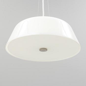 An Arne Jacobsen "Centenary Package" comprising three "Ant Chairs" and an eggshaped table, Fritz Hansen, Denmark.